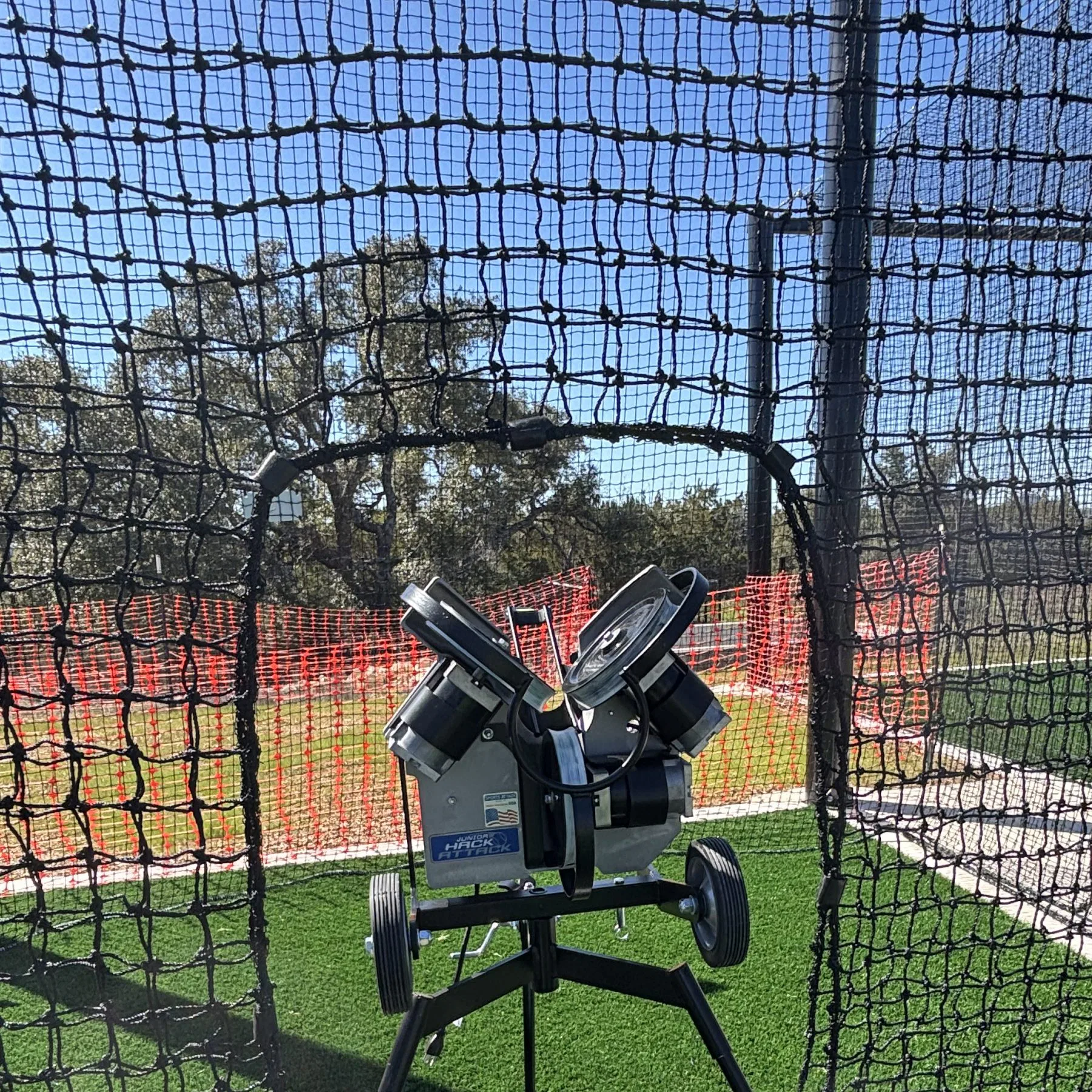 Baseball Pitching Machine Rental behind screen